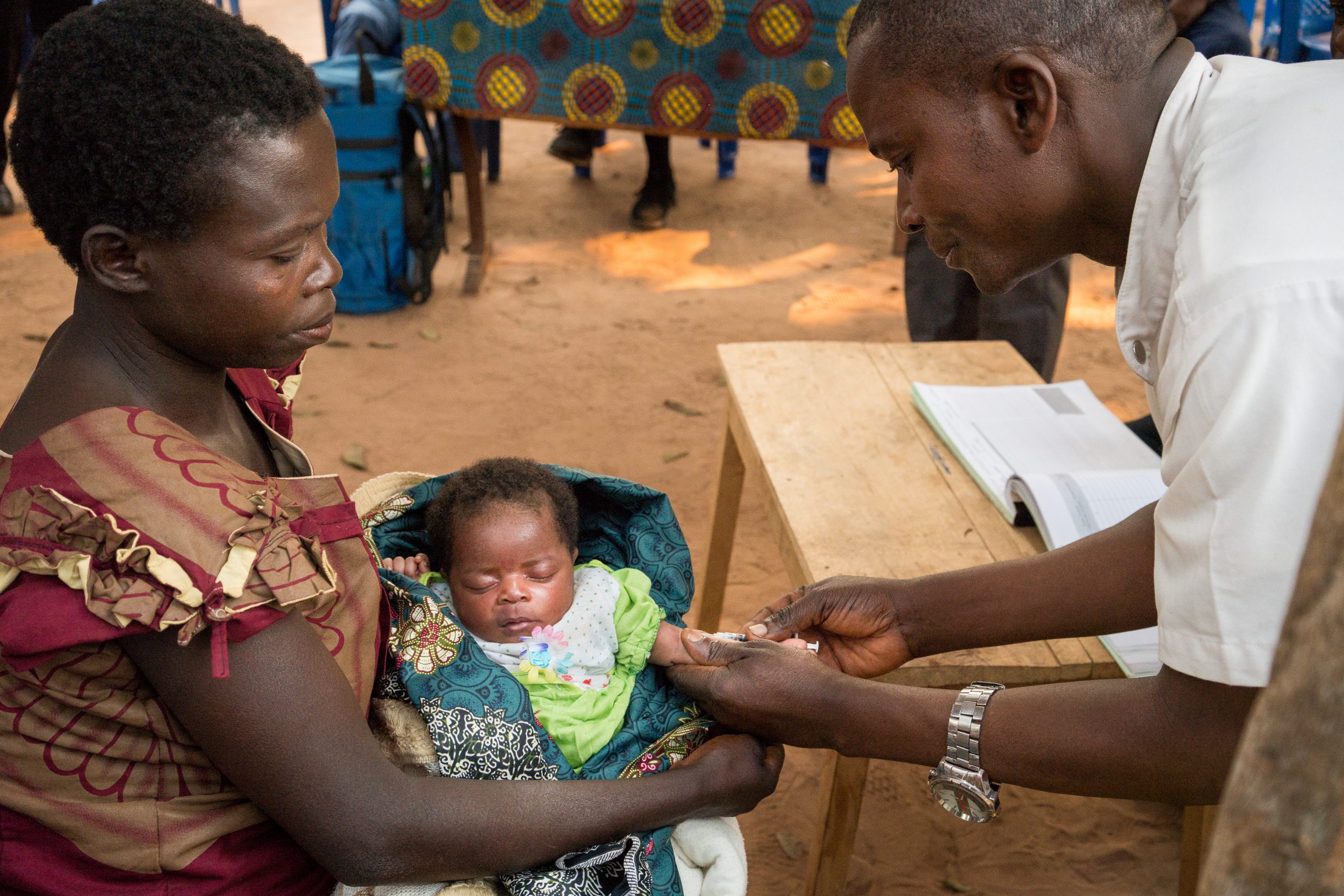 Yvonne Wabanza, 31, holds her 1-month old baby as a nurse administers a BCG vaccine at the Health Center in Kamwenze, Kabongo territory, Haut-Lomami province, Democratic Republic of the Congo on July 24, 2019. This is Yvonne's 6th child.