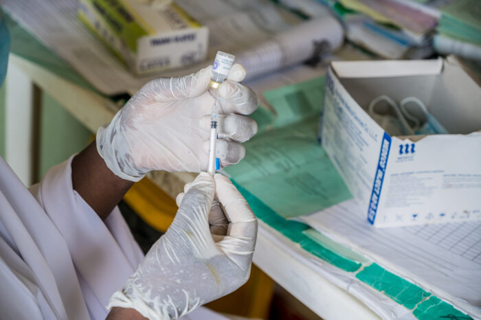 Image of medication being retrieved from a vial.